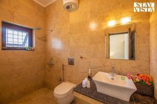 StayVista at Olive fields with Shared pool, BBQ - 3