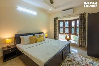 StayVista at Olive fields with Shared pool, BBQ - 4