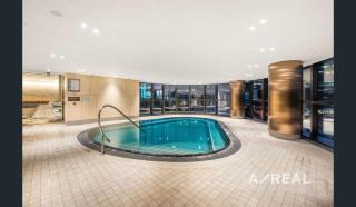 Modern Docklands Apartment River Views Near CBD - 0