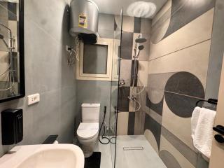 832 . Modern 1BR Apartment Prime Location - 1