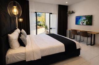 The Monochrome Apartment 209 - Urban Chic Escape - Open Plan Bathroom with Bathtub - 9