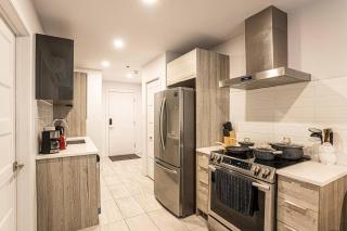 Sleek Modern 2BR Getaway with Gym & Rooftop Views Near Downtown & Airport - 8