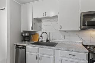 Cozy Transitional Stay in KC Easy Garage Yard - 7