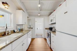 Sunny oceanfront home with balcony, full kitchen, central AC, & washer/dryer - 1