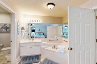 Gated golf resort condo with balcony, AC, deck, WiFi, volleyball, & tennis - 1