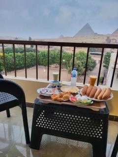 Queen Nefertiti -Pyramids view - 1