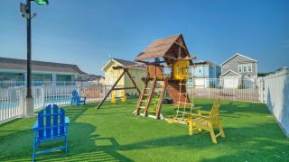 Pool Playground Patio Living Family-Friendly Clamshell Cottage by AvantStay - 5