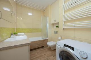 Cozy Apartment with Balcony near PGE Narodowy by Noclegi Renters - 5