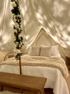 Peaceful Glamping Tents with Elevated Decks, Cozy Fire Pit, and Secluded Forest Views Near Gentry, AR - 1