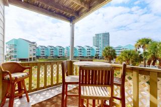 Condo with partial bay view onsite fishing dock beach access & shared pool - 7
