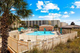 Bright ocean-view condo with community pool and direct beach walkway - 8