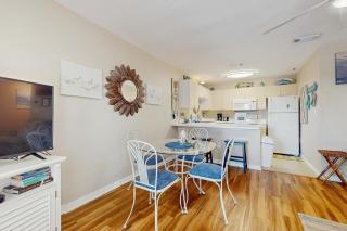 Bright open 3rd-floor condo with pool views from private balcony - next to beach - 3