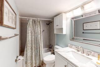 Updated bright condo with beach setup - minutes from entertainment - 2