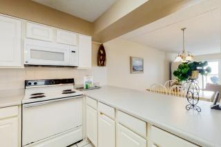 Updated beachfront condo with beach setup - quick drive to entertainment - 2