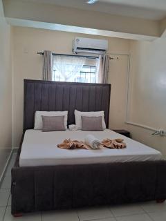 Cozy 2 BR with 3 Beds, AC & Hot Shower at Buxton Point Apartments Off RG Road Gate A - 9