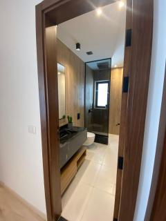 A luxurious bedroom and a cozy living area with a stunning view of the swimming pool - 1