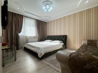 Уютная квартира напротив спорткомплекса Almaty Arena - 0