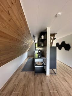 A Frame cottage surrounded by a forest - 2