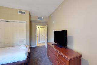 Inviting 4th-floor condo with elevator, screened balcony, washer/dryer & AC - 2