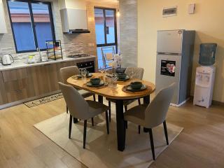 spacious luxury two bedroom apartment with heated swimming pool fully equipped gym children playing ground ample parking space and relaxing rooftop with amazing views - 1