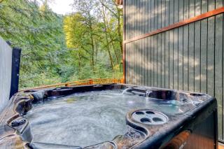 Creekside home with hot tub deck & great woodland views - 5