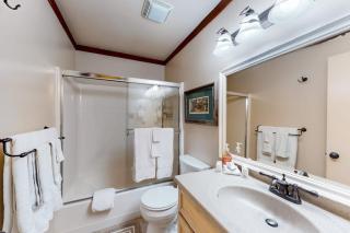 Spacious townhome with creekside patio & gas fireplace - 10-minute walk to lake - 1