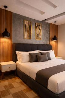 Luxury 2 Bedroom Sky Suite at Gold Crest Lahore with City Views, Xbox & Foosball - 1