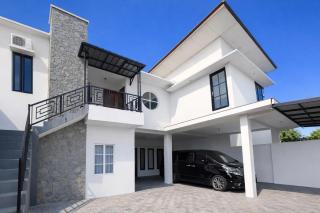 RedDoorz at Mouza Guest House Antapani Arcamanik Bandung - 9