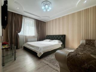 Уютная квартира напротив спорткомплекса Almaty Arena - 0