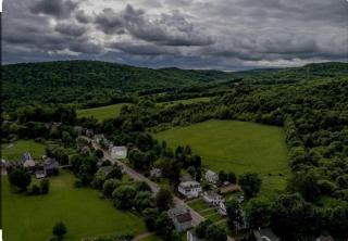 Peaceful Village Retreat Blending Rustic Charm with Modern Style in Bovina, New York - 9