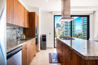 5th-floor condo with partial ocean views, heated pool, sauna, gym, balcony, W/D - 0