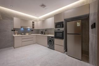 Luxury 2-bedroom apartment with living room, dining area, and modern kitchen - 6