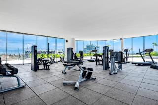 Updated condo with sweeping views, pools, fitness room, balcony, W/D, and AC - 2