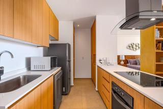 Oceanfront condo with a full kitchen, pool, & beach access - 1