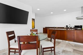 Modern hillside suite with balcony, city view, pools, gym & full kitchen - 1