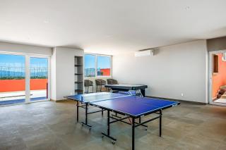 Mountain-view apartment near beach with balcony, rooftop pool, gym, & Ping-Pong - 8