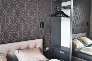 Modern central Riga apartment with balcony, gym access, dedicated parking, kitchen & AC - 1