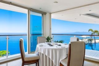 Modern hillside suite with balcony, city view, pools, gym & full kitchen - 3