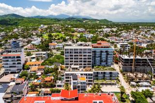Modern waterfront condo with shared pool, balcony, and washer/dryer - 0