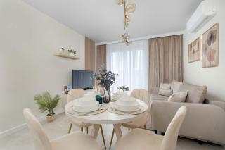 Air-Conditioned Apartment with Parking and Balcony by Noclegi Renters - 1