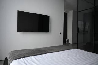 Modern Dark Minimalist Apartment with Panoramic Views - 5