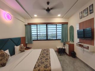 HOTEL EARTH INN, Subhash Bridge, RTO Circle, Ahmedabad - 4