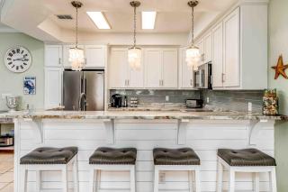 Ground-floor condo next to on-site pool with private patio & beach access - 3
