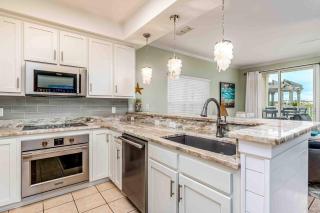 Ground-floor condo next to on-site pool with private patio & beach access - 2
