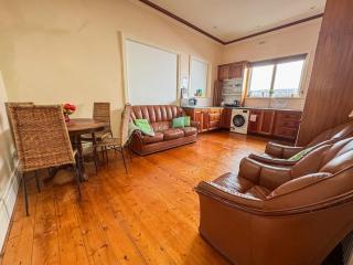 A large, light-filled room in a character Edwardian terrace in the heart of Balaclava. Original Baltic pine floors, soaring ceilings with decorative cornices, bay window, and an ornamental fireplace give the space genuine period charm. Shared with other g - 9