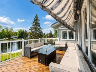Canalside Summer Cottage with Waterview, Custom Bar, BBQ, and Fireplace - 6