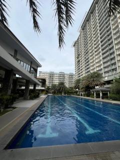 2br condo unit with two balconies that offer a picturesque ocean view and city skyline - 7