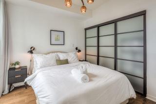 Downtown 2BR condo with city views and free parking - 9