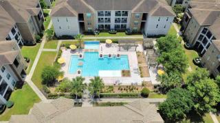 Sunny 2BR Magnolia Escape Pool Gym & Location - 1
