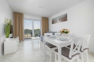 Cozy Apartment with a Balcony and Parking by Noclegi Renters - 4